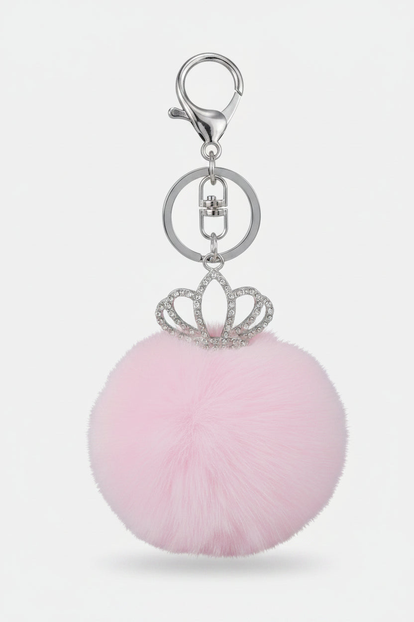 Keychain with pink pom-pom and decorative crown charm
