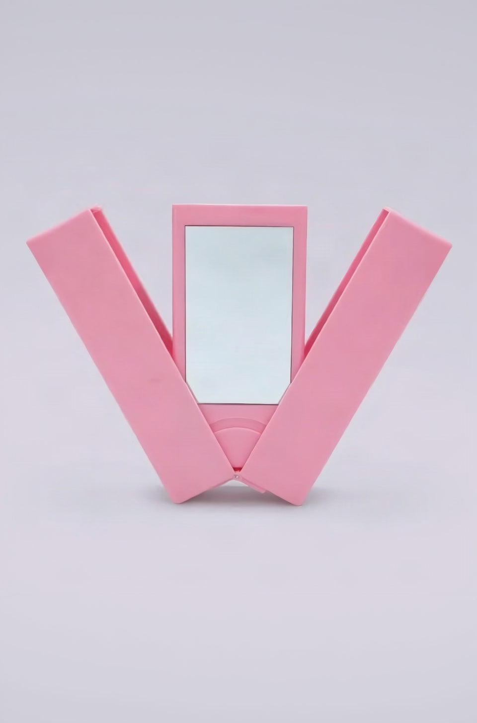 A pink foldable makeup case with a rectangular mirror in the center.